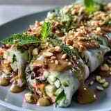 Sliced grilled chicken, julienned veggies, and fluffy jasmine rice create a hearty, deconstructed Rice Paper Roll Bowl for a satisfying weeknight dinner.