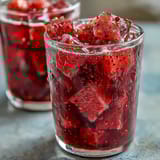 Refreshing homemade mango dragonfruit refresher with vibrant tropical colors and fresh fruit garnish in tall glasses.