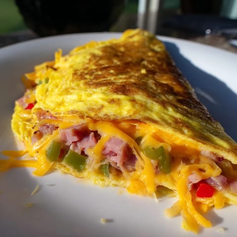 Hearty Denver omelet served golden brown, perfect for a hearty American breakfast.