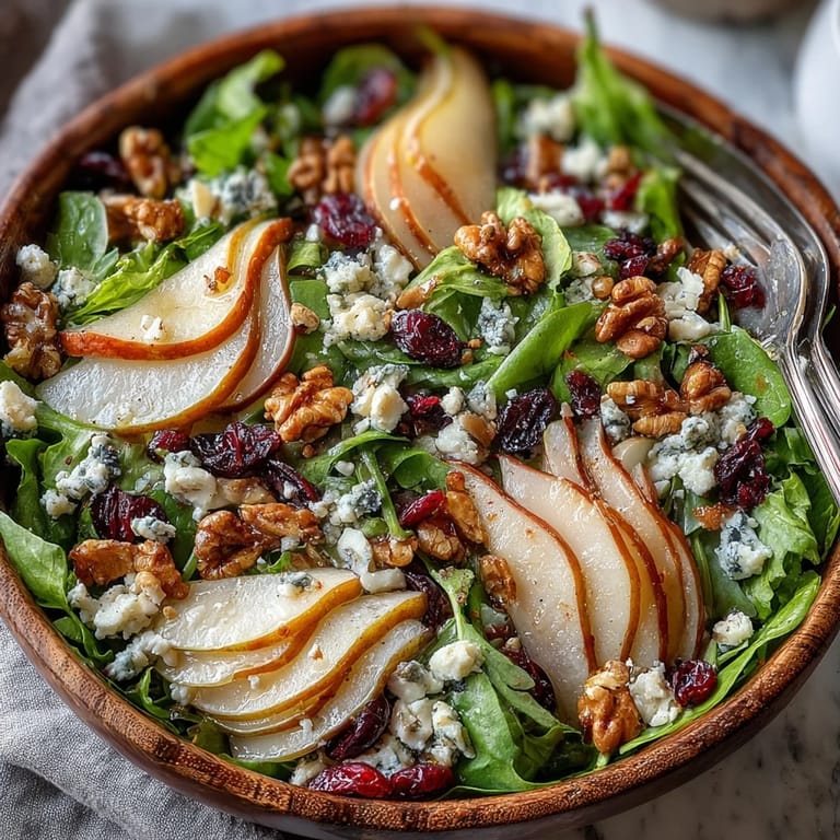 Vibrant Pear Gorgonzola Salad featuring creamy cheese and toasted nuts.