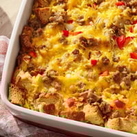 Freshly baked Breakfast Sausage Casserole, featuring golden bread cubes and savory sausage baked into a fluffy egg base. 